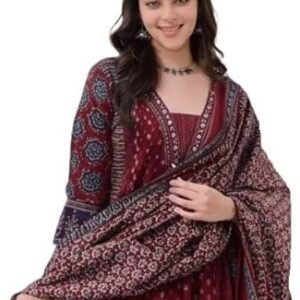 Woman wearing a maroon printed ethnic kurta with a matching patterned dupatta, posing against a plain background.