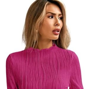 Woman wearing a bright pink textured high-neck top with long sleeves, posing against a plain background.