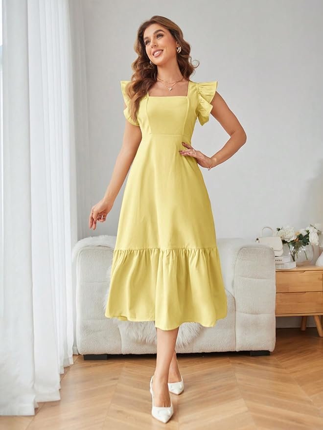 Woman wearing a pastel yellow midi dress with ruffle sleeves and a flowy hem, posing against a plain background.