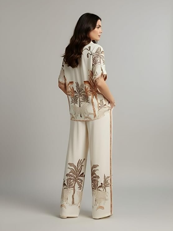Women's ivory tropical print co-ord set with relaxed shirt and wide-leg pants.