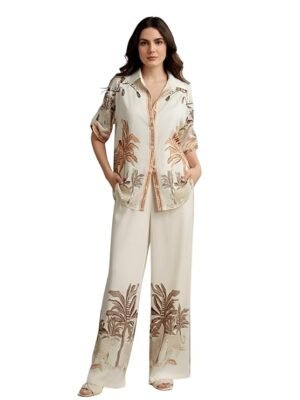 Women's ivory tropical print co-ord set with relaxed shirt and wide-leg pants.