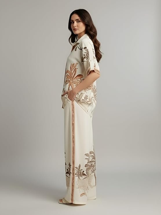 Women's ivory tropical print co-ord set with relaxed shirt and wide-leg pants.